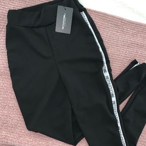 “ Black pretty little things side tape leggings “